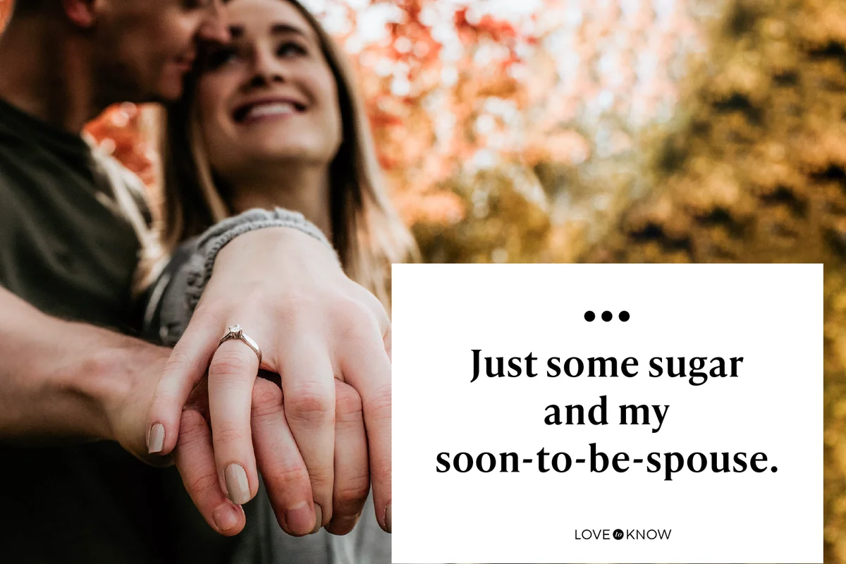 Young couple in love showing off engagement ring