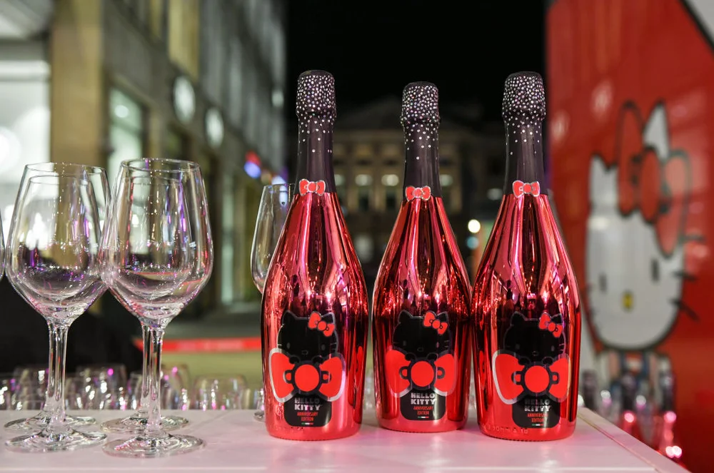 14 November 2019, Berlin: Red champagne bottles of a Hello Kitty Anniversary Edition and champagne glasses at the party for Hello Kitty's 45th birthday in the Mall of Berlin. Photo: Jens Kalaene/dpa-Zentralbild/ZB (Photo by Jens Kalaene/picture alliance via Getty Images)