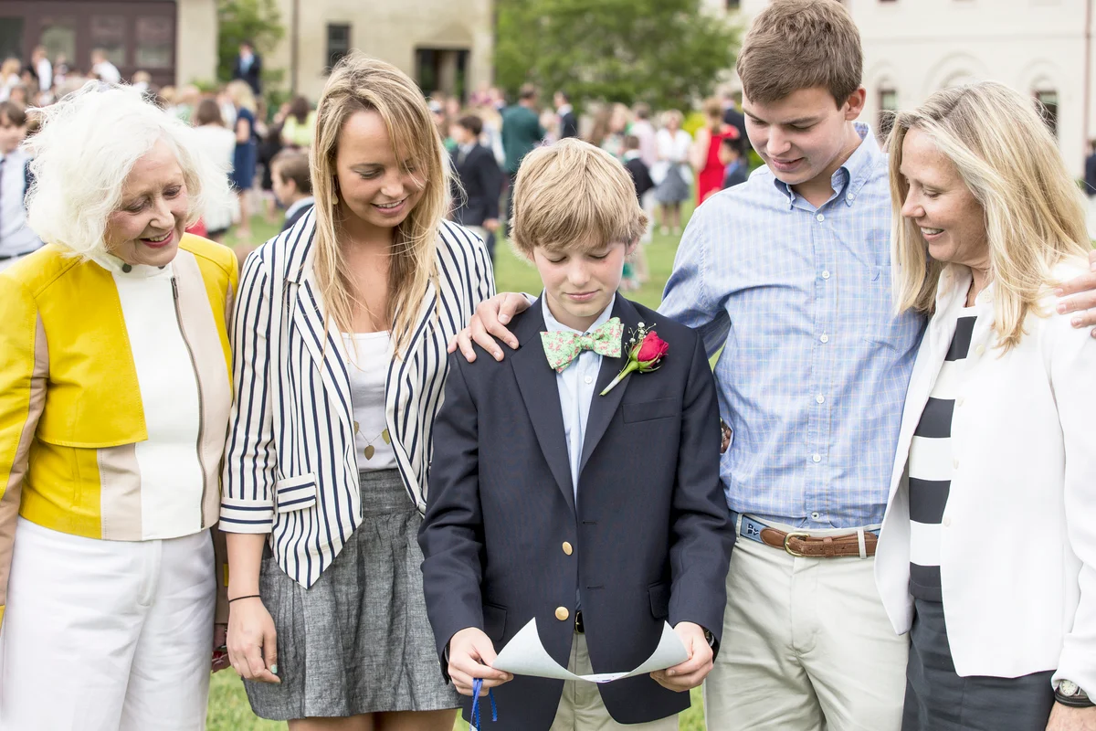 Family Smiling at middle school graduation