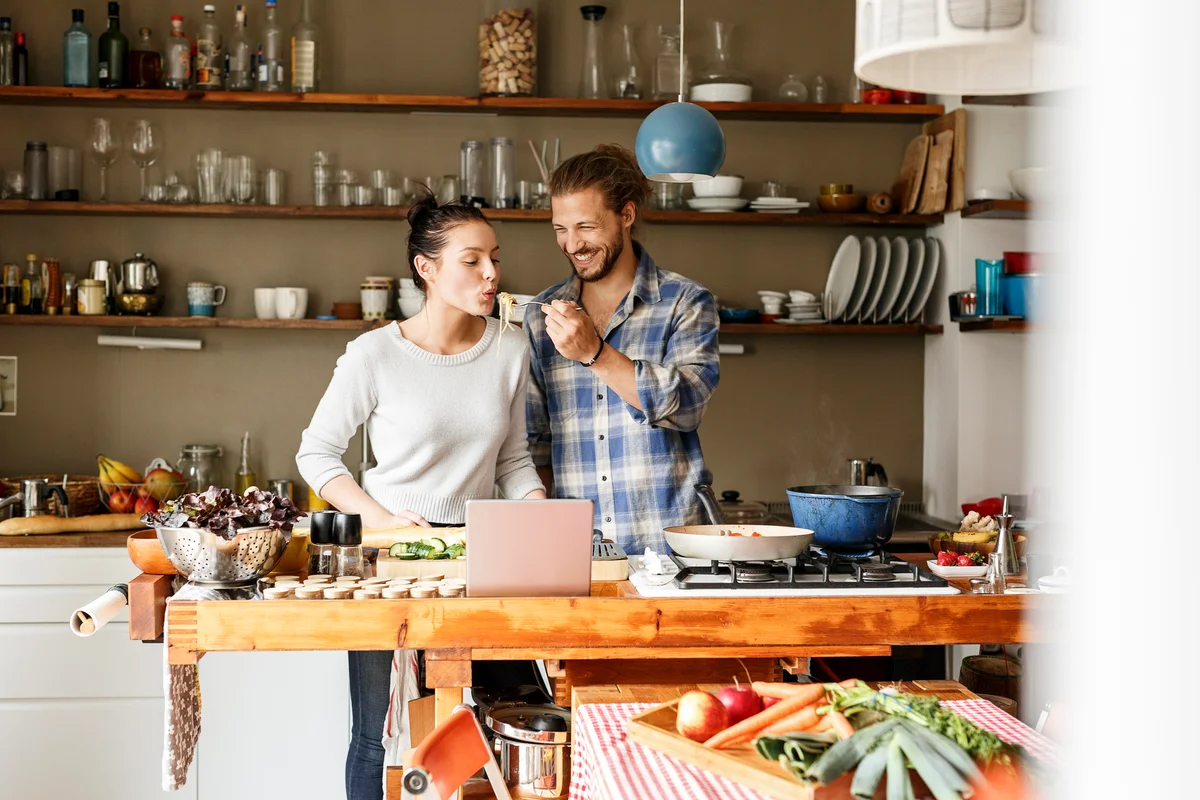 Happy couple having a cooking date night