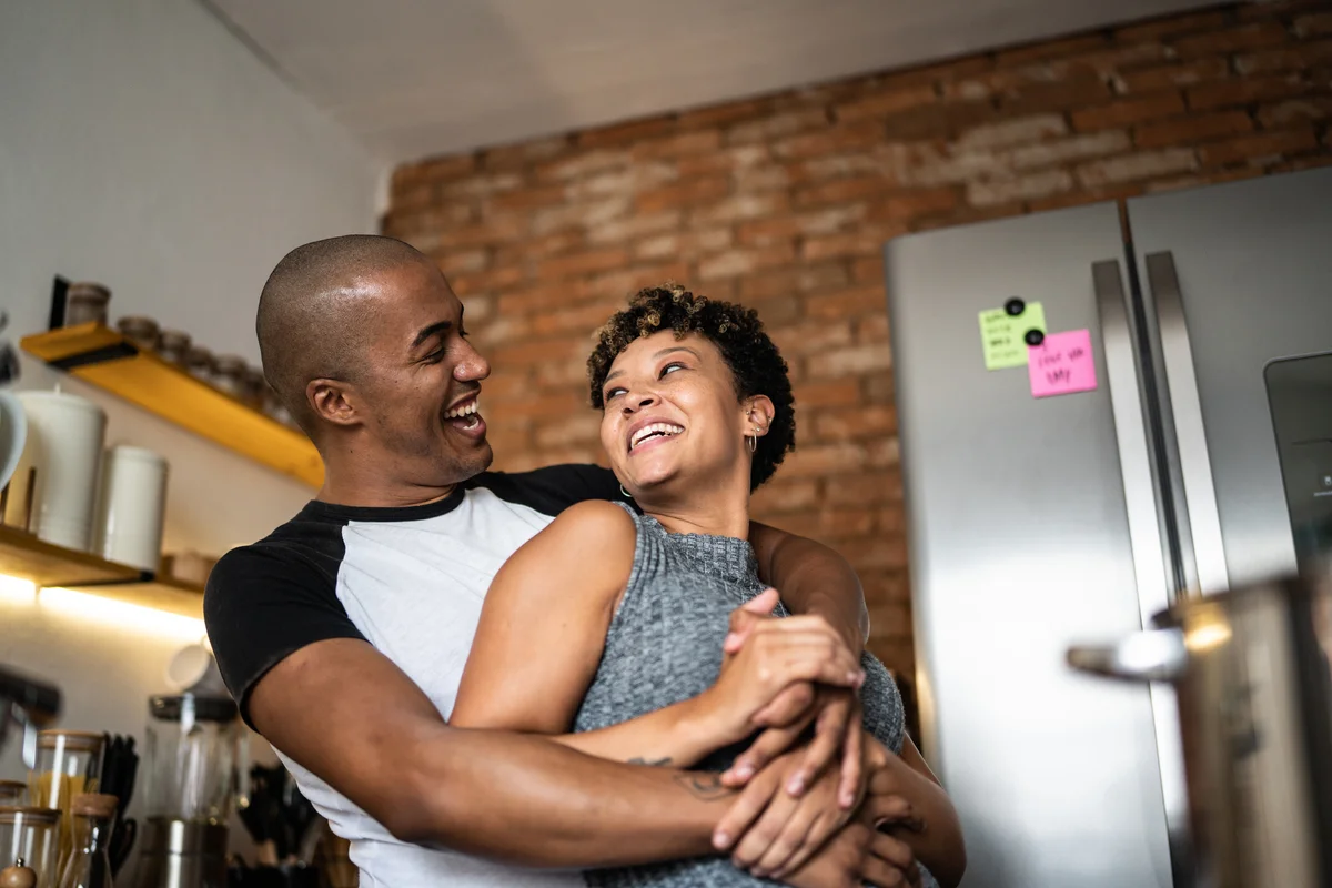 Couple dancing in kitchen