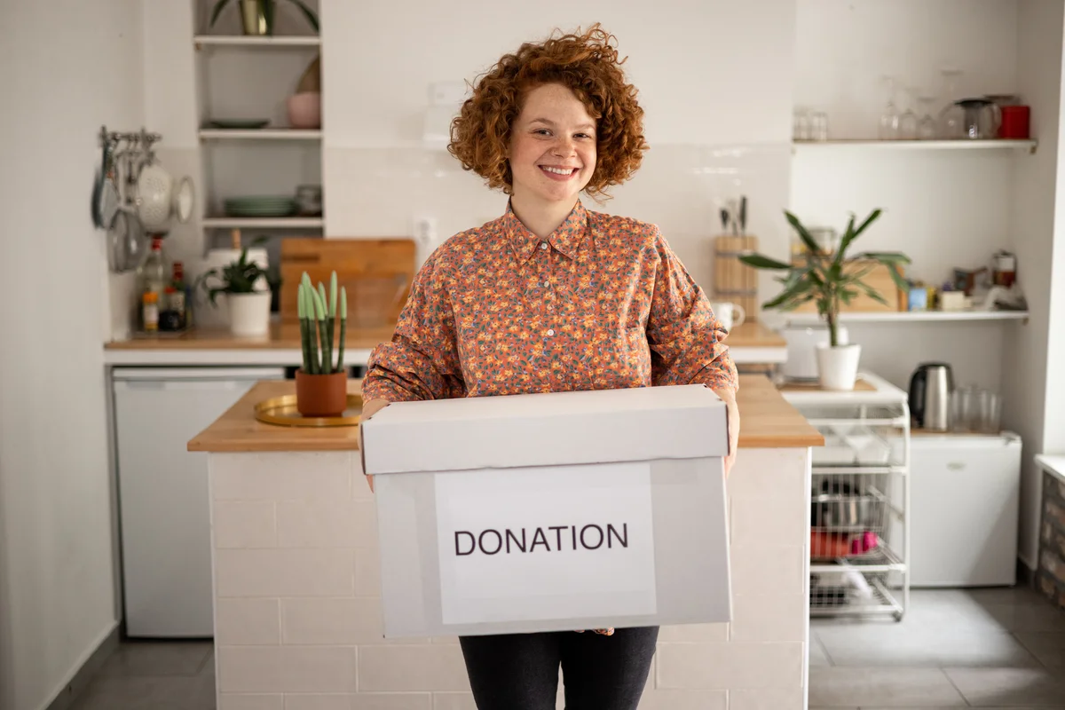 woman holding donation box