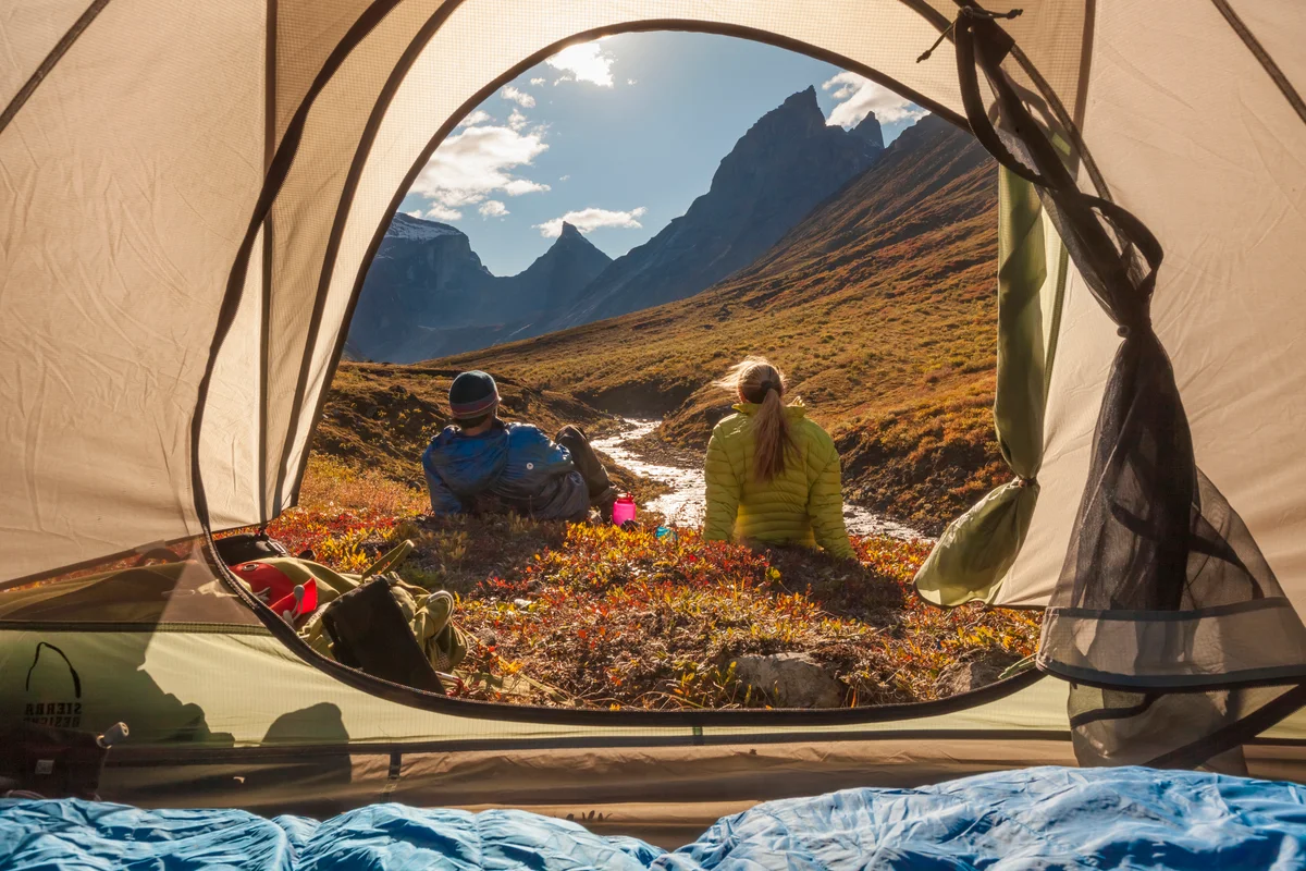 Couple tent camping in Alaska