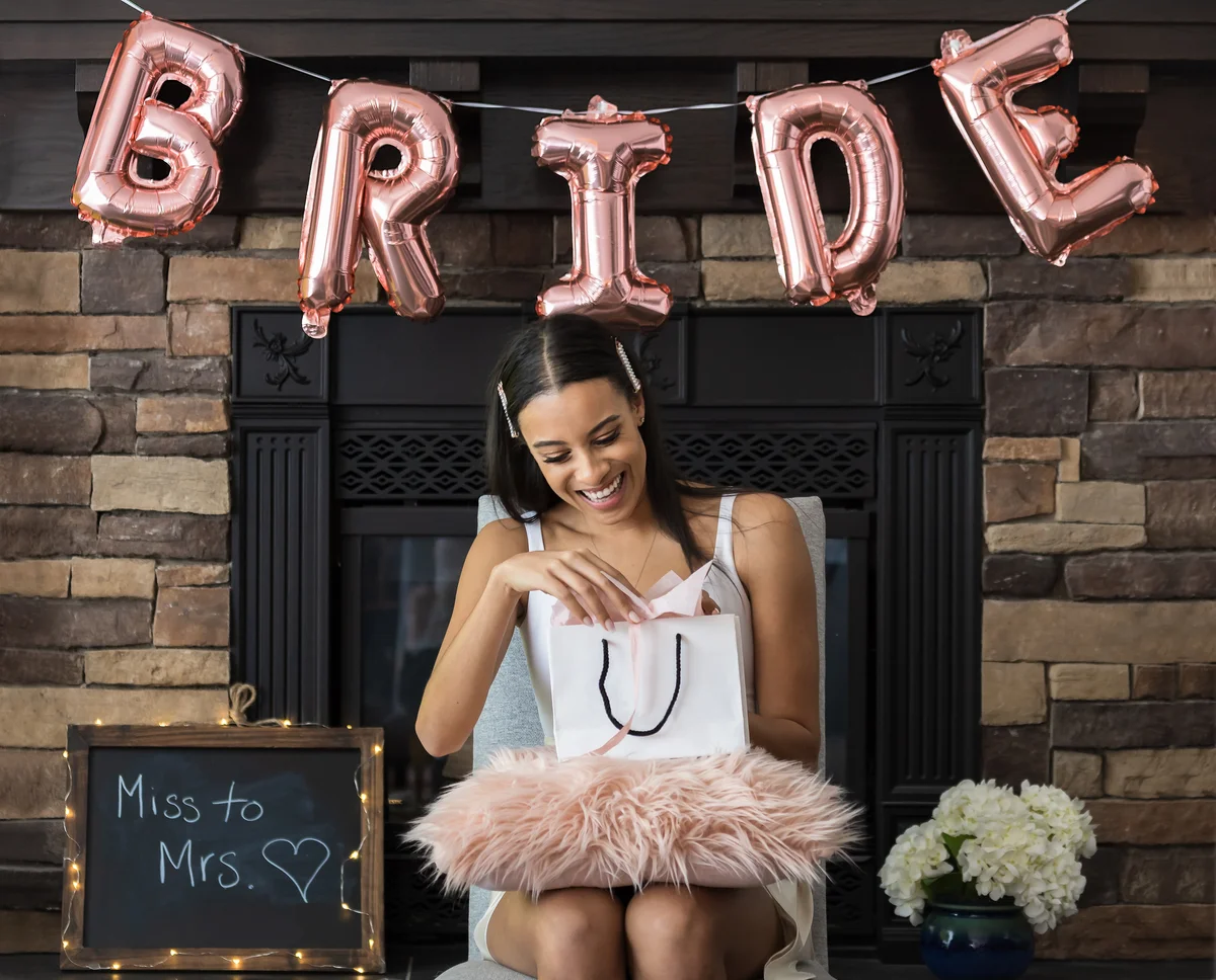 bride opening a gift at a shower