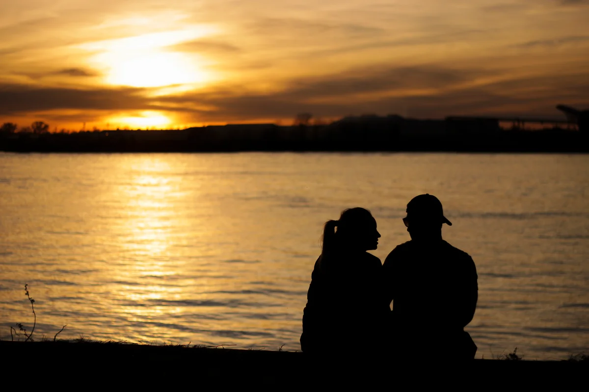 Couple watching sunset on Mississippi River