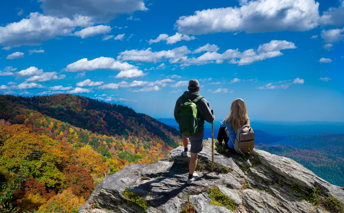 Couple on hike enjoying views of mountains in North Carolina