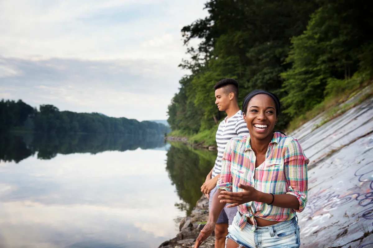 Young couple having fun by the lakeside in Pennsylvania