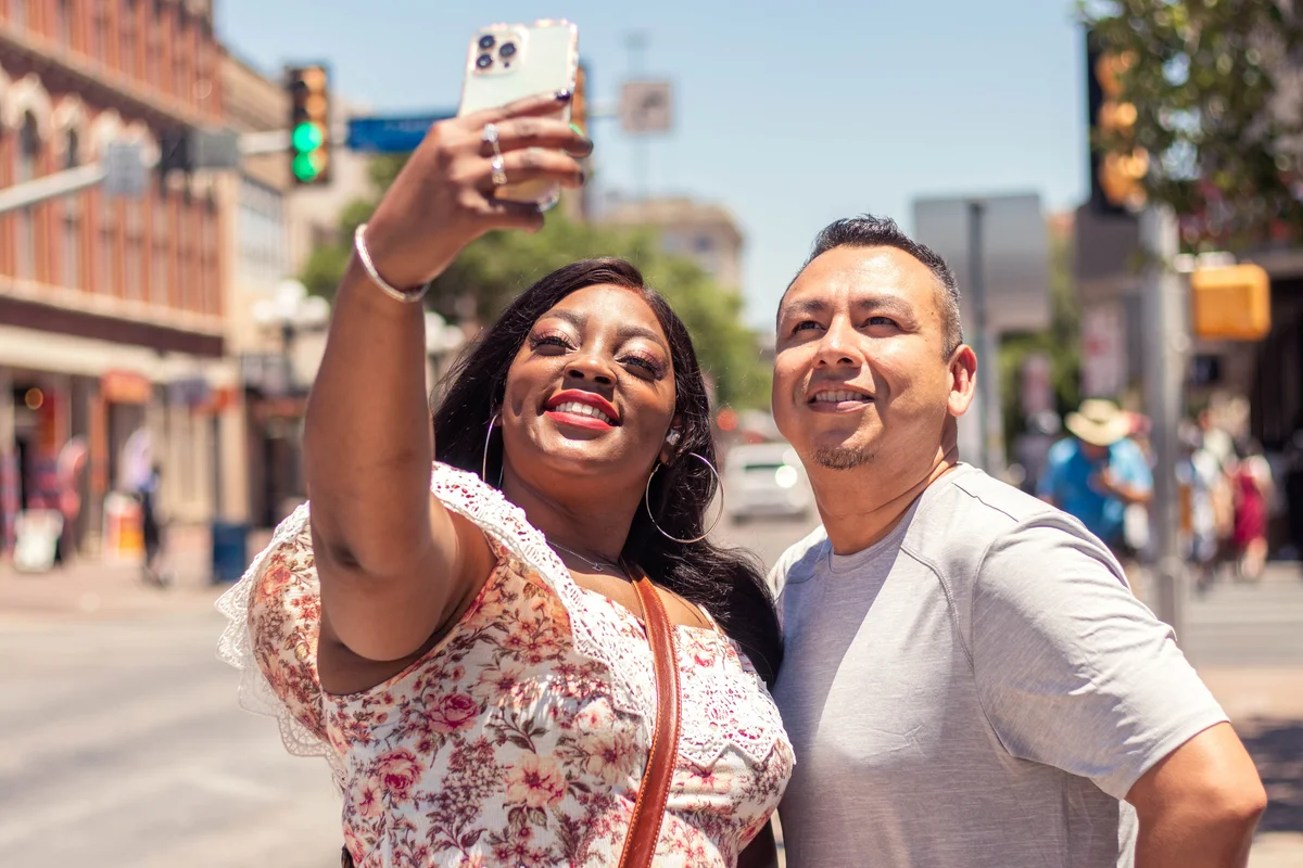 Texas couple taking selfie downtown