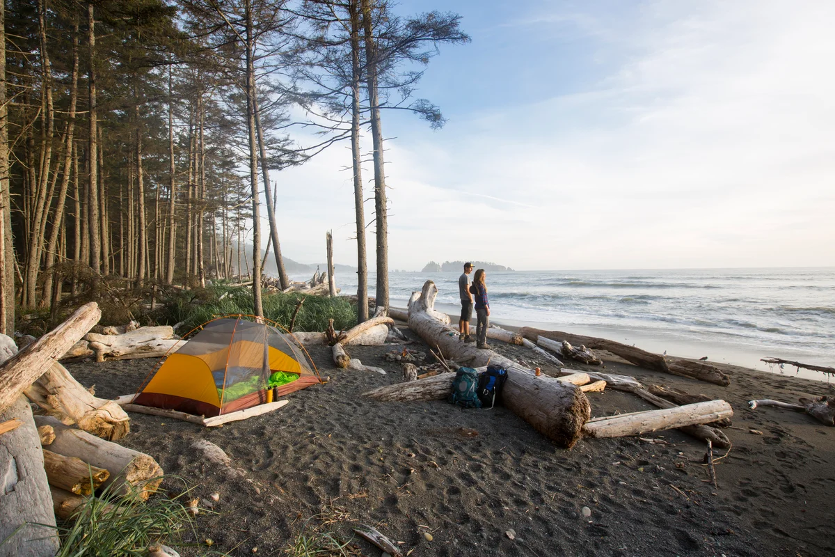 Couple camping on beach in Washington