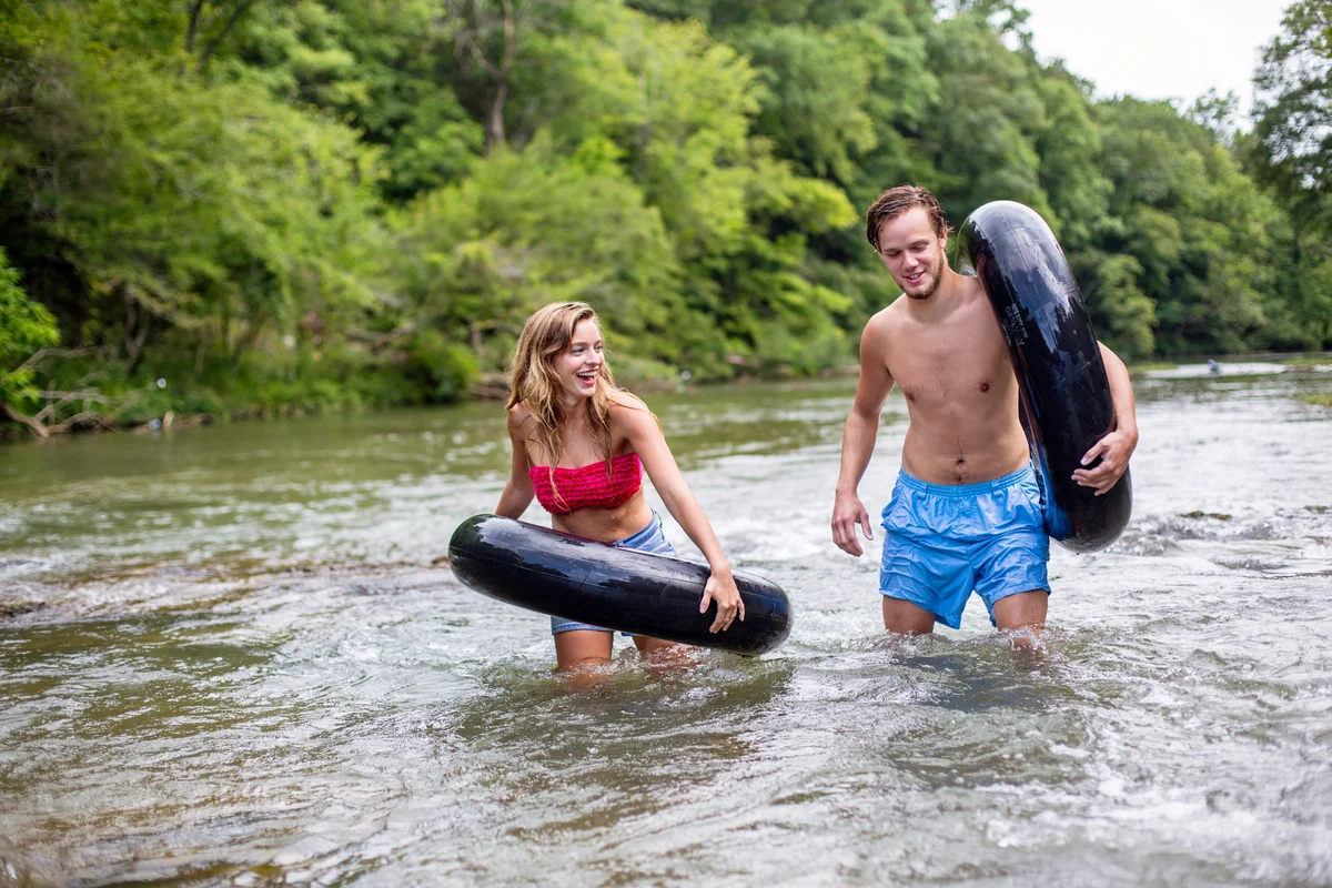 Couple going tubing in river in Alabama