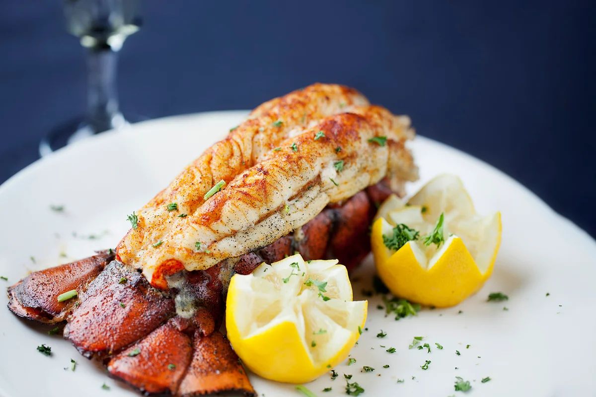 Large lobster tail served with white wine