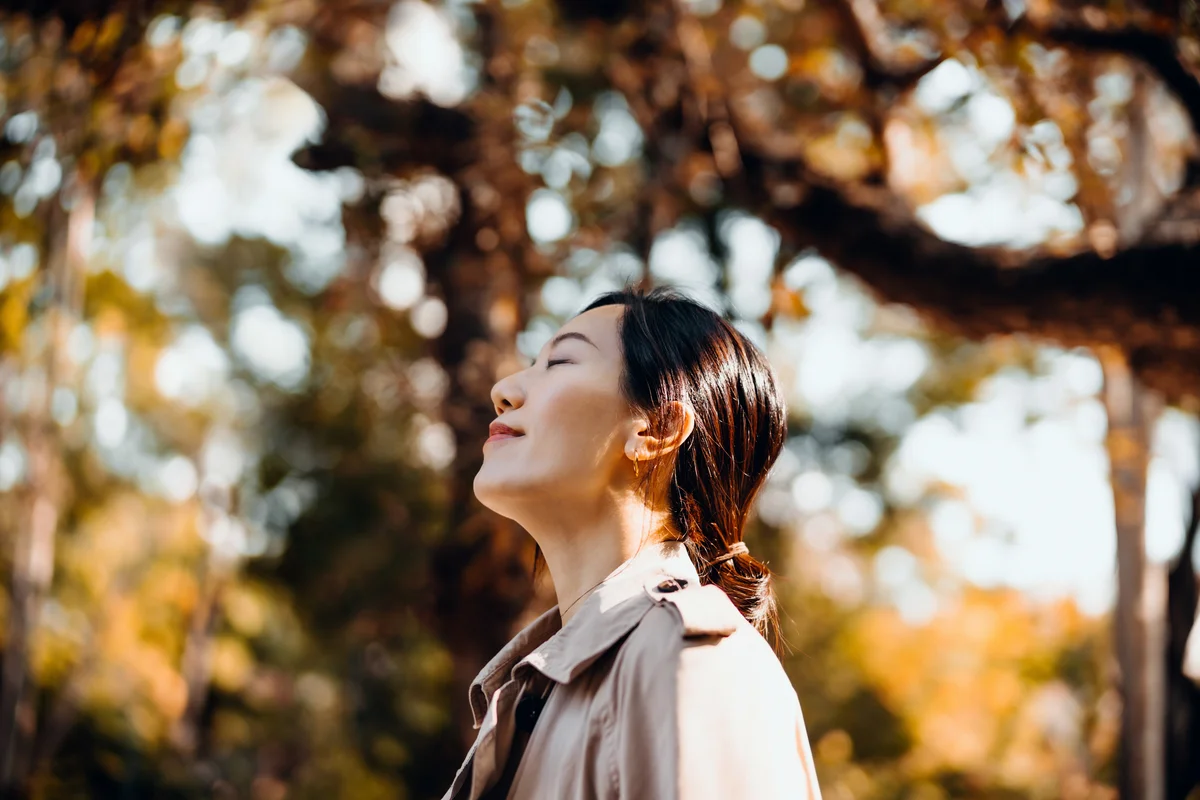 woman breathing outdoors