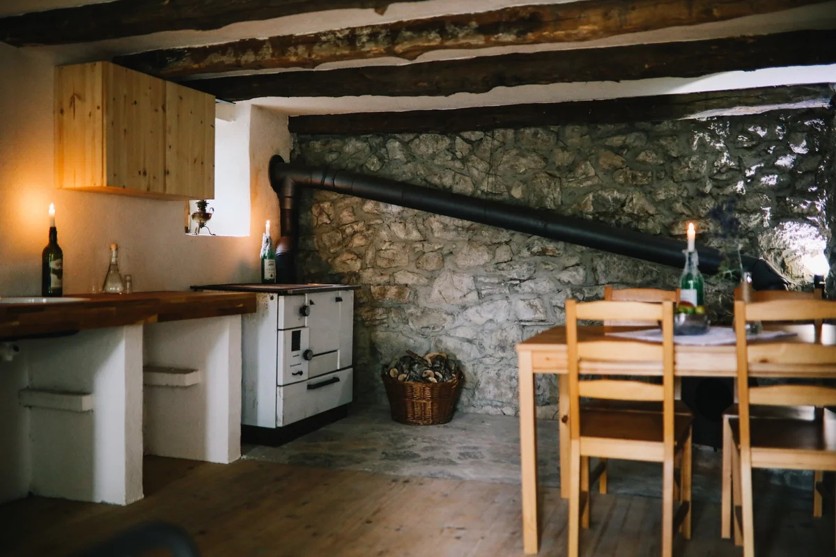 Summer kitchen with stone wall