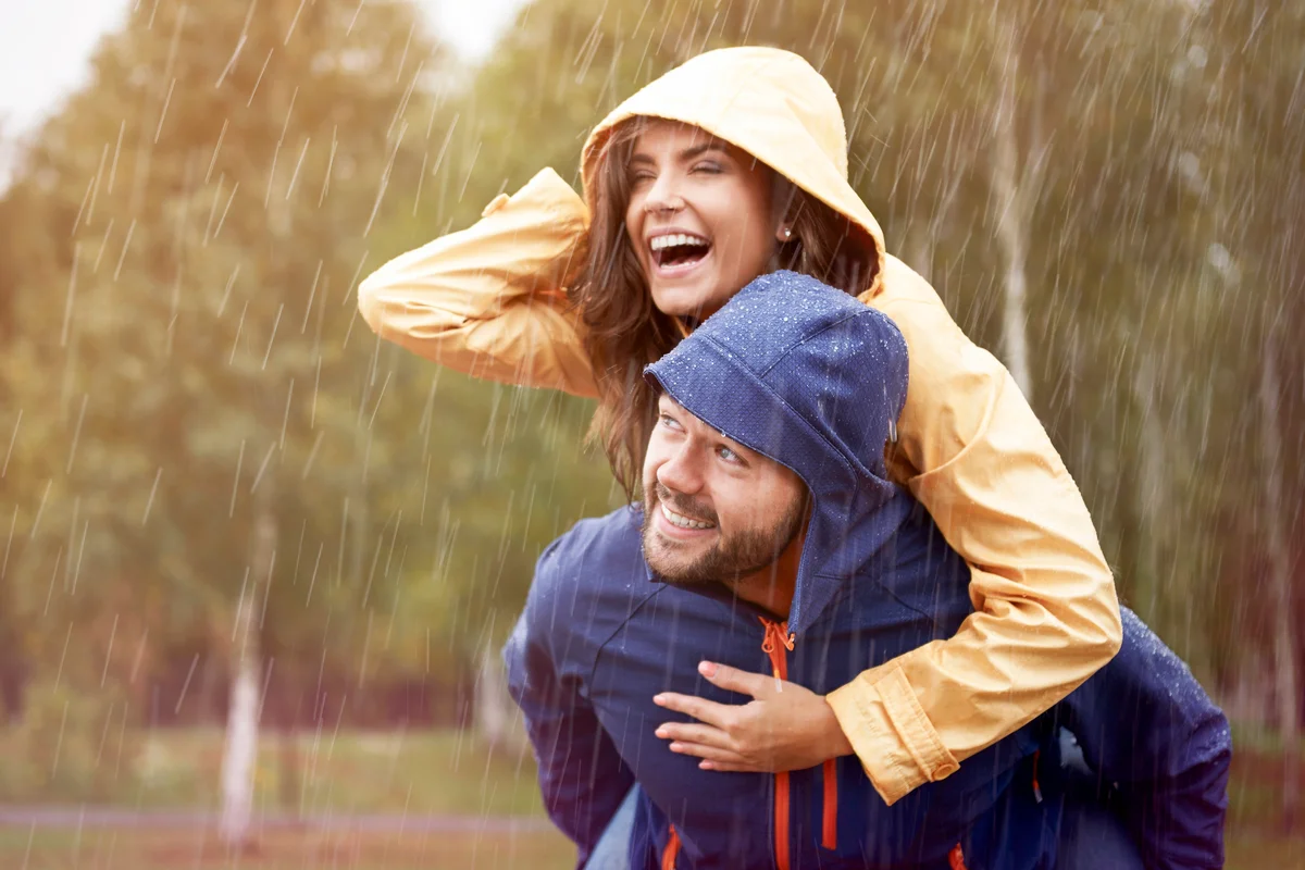 Couple having fun in the rain