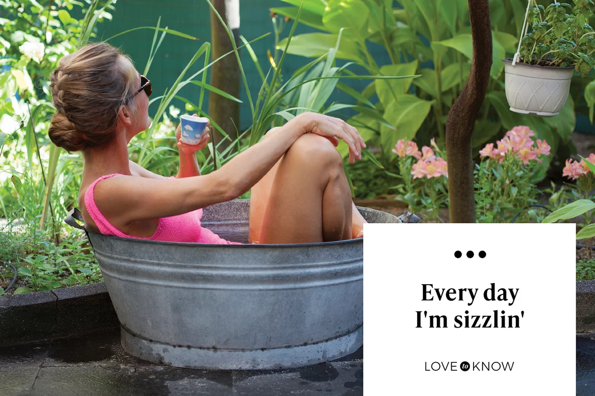 Woman bathing in small tin tub in the garden