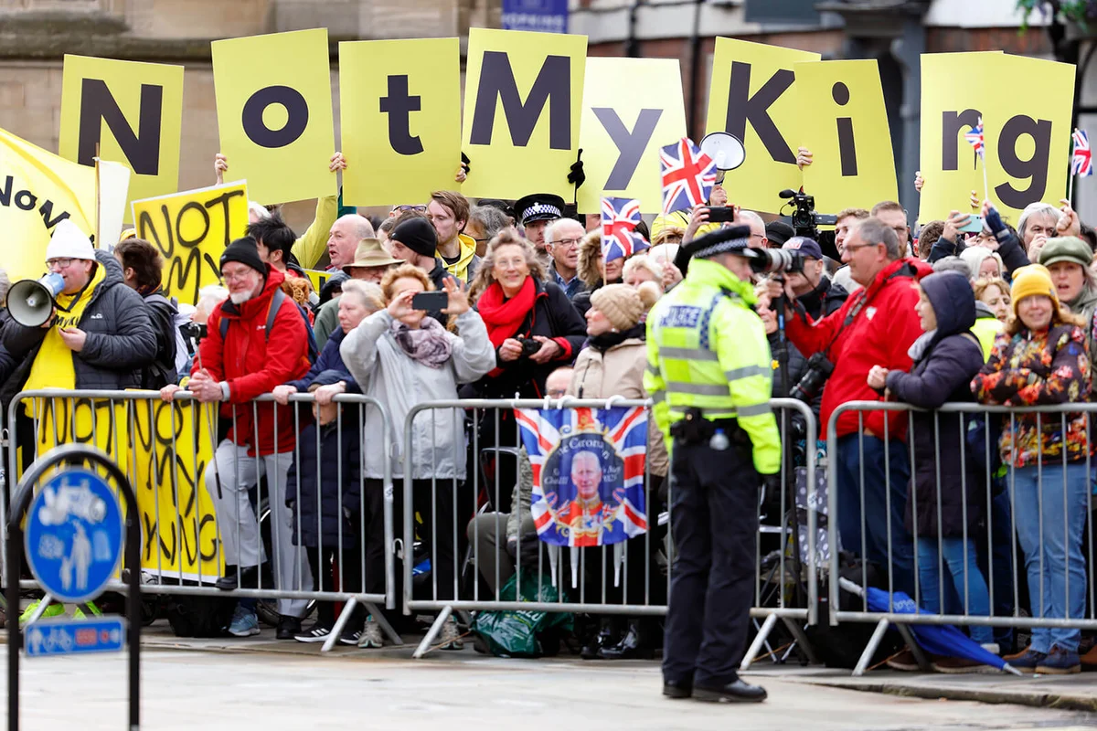 Anti monarchy protestors from the pressure group Republic wave 'Not My King' banners