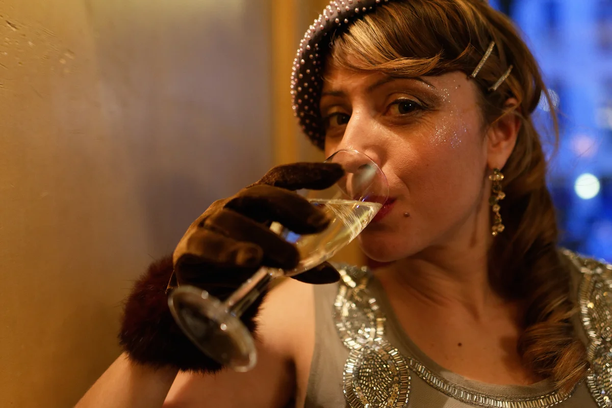 flapper sipping Champagne