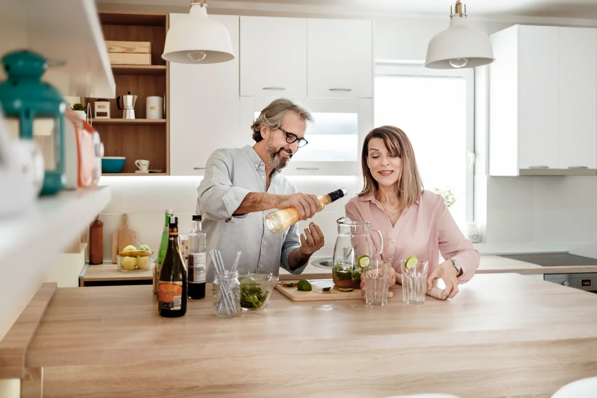 Couple Mixing Cocktails in the Kitchen