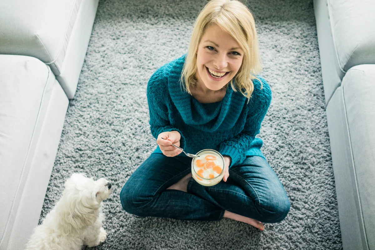 woman eating yogurt