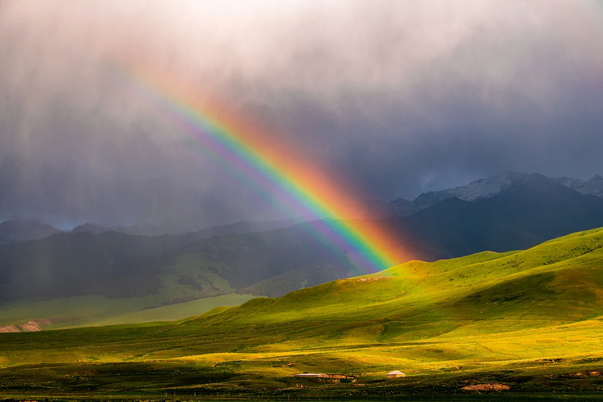 Breathtaking View of Kakshaal-Too Mountains with rainbow