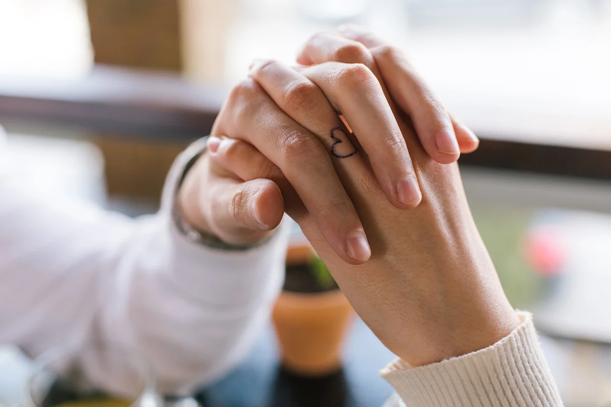 Couple holding hands
