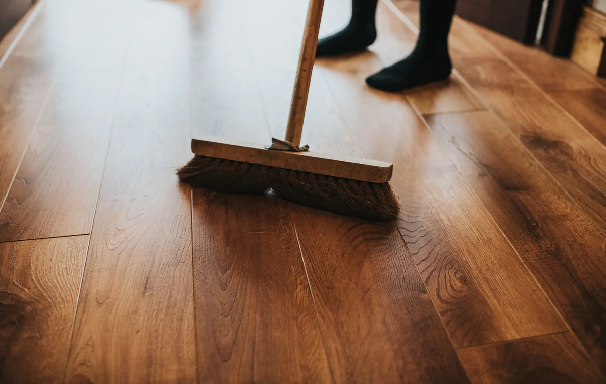 sweeping wooden floor