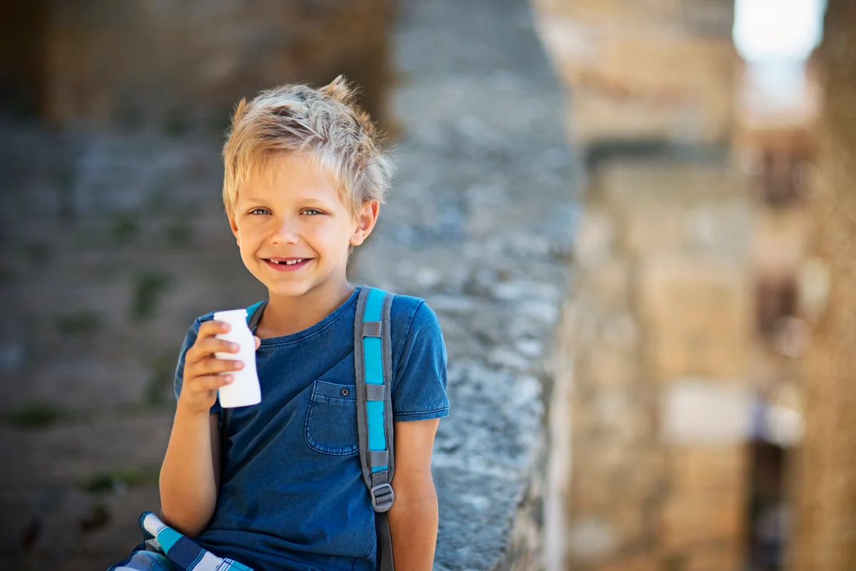 Kid drinking yogurt
