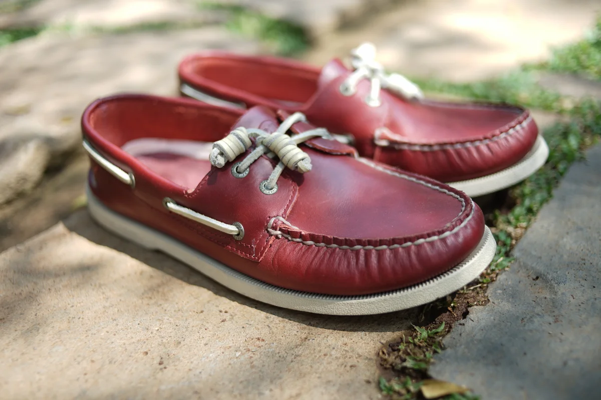 a pair of red leather Sperry shoes