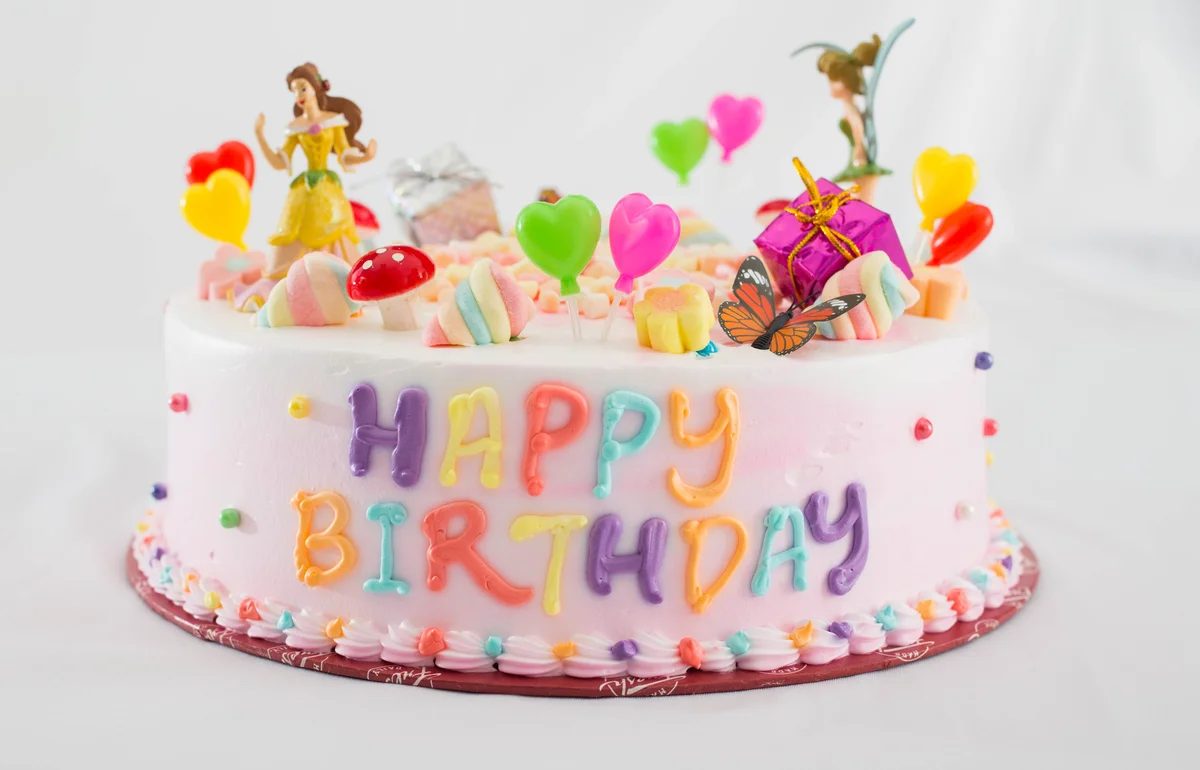 Birthday cake featuring a few Disney princesses