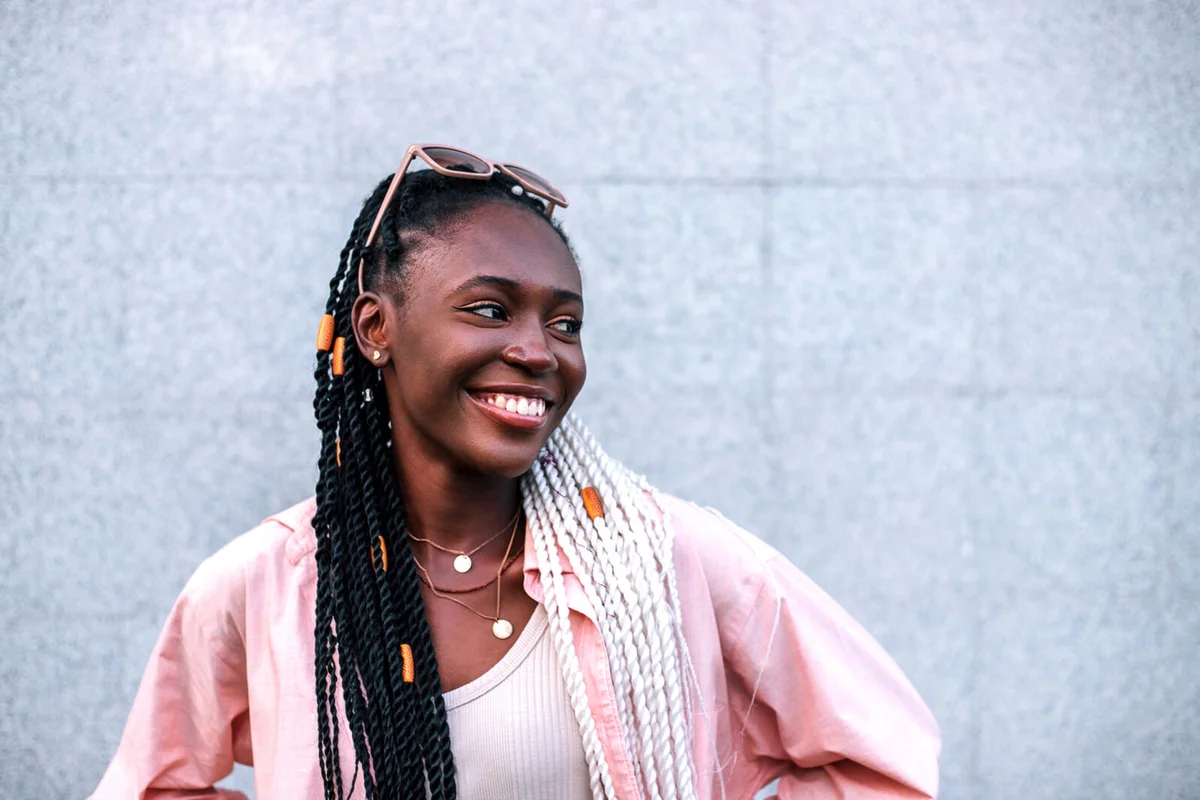 woman smiling outdoors in the summer