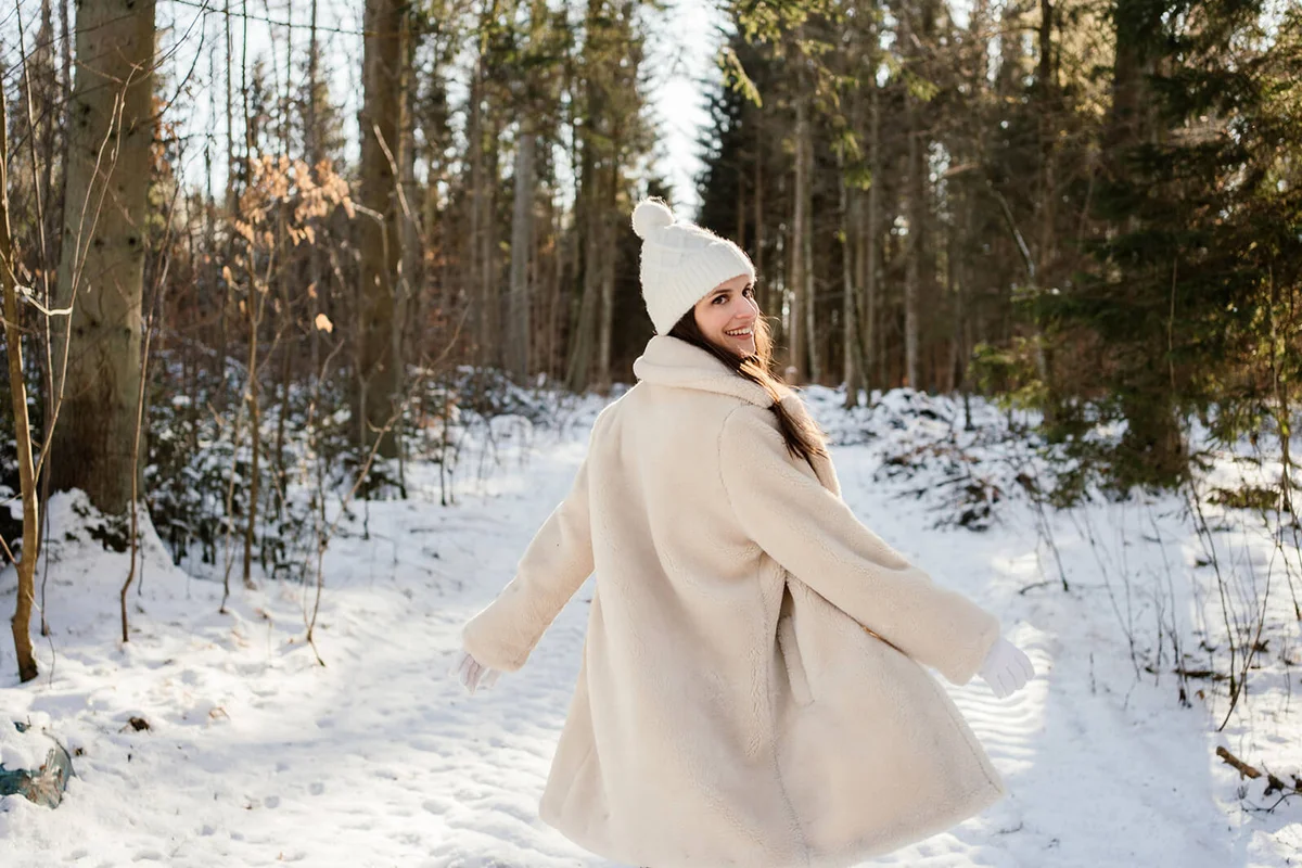 Woman dancing in the winter sun