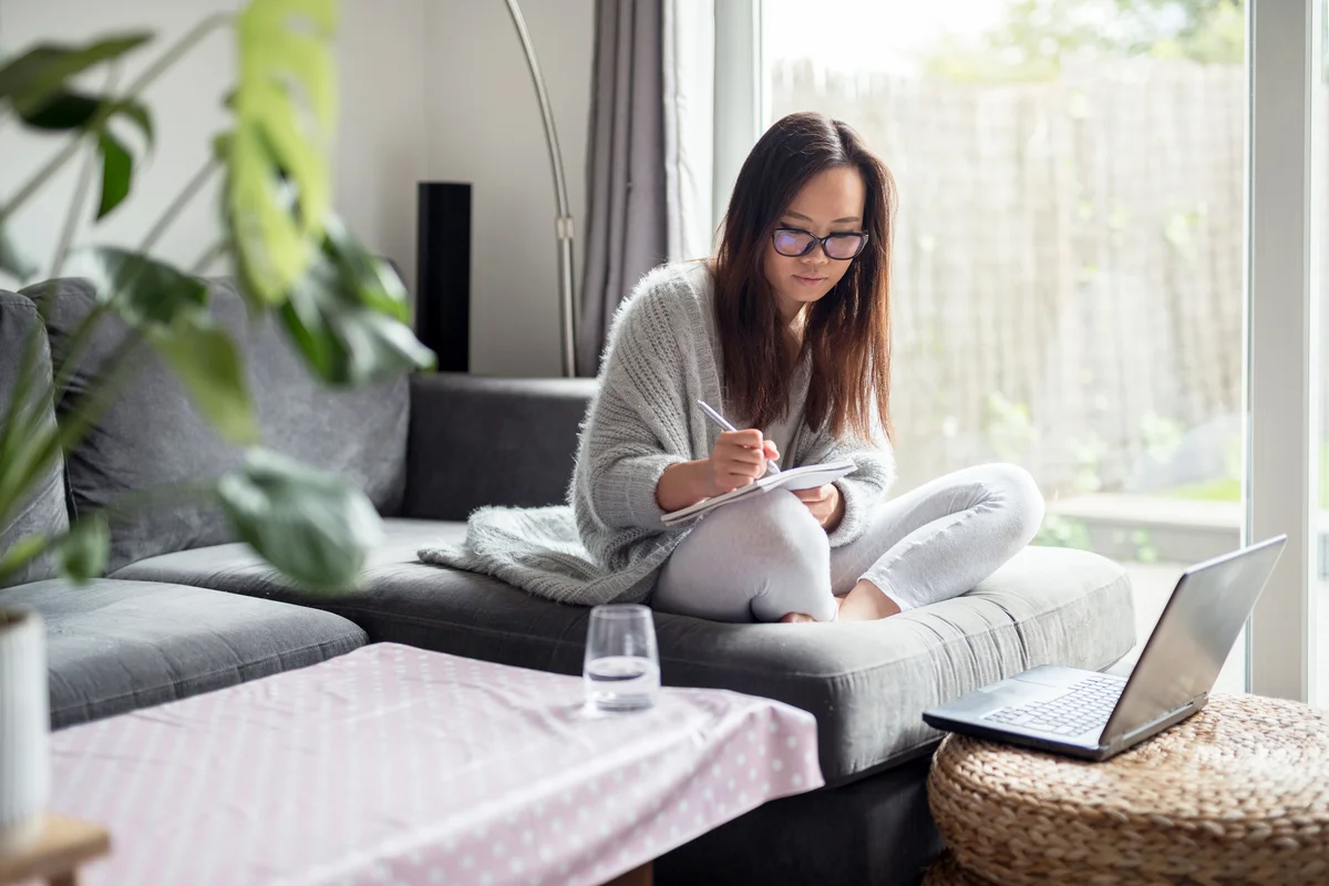 Woman writing in her journal
