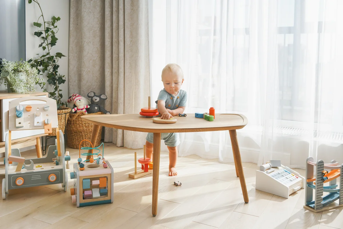 Baby boy playing with wooden toys