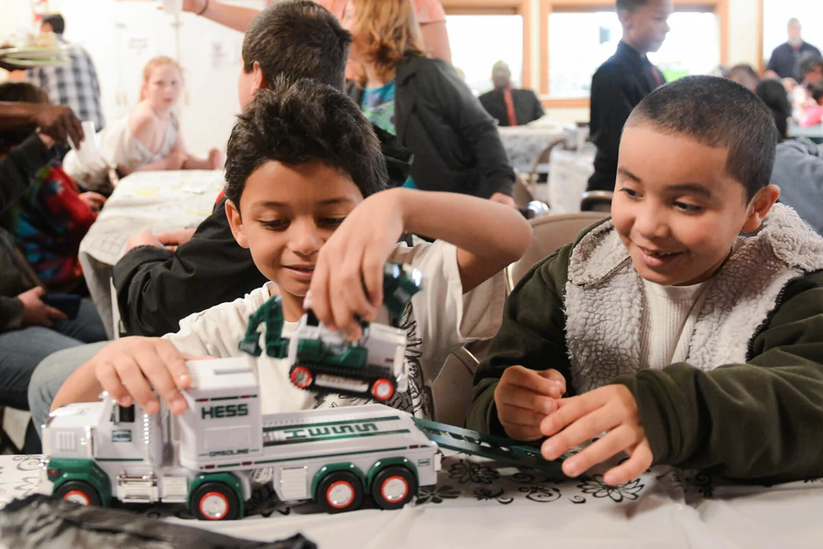Kids play with the Hess Truck