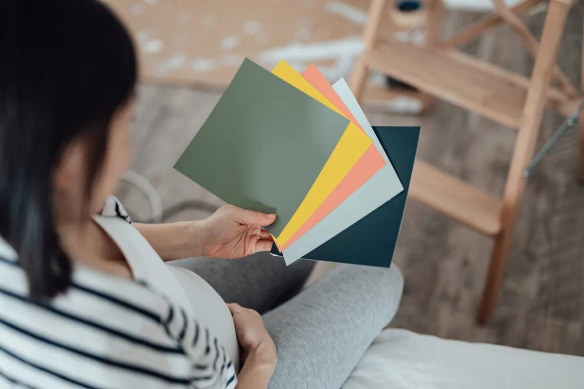 woman holding color swatches