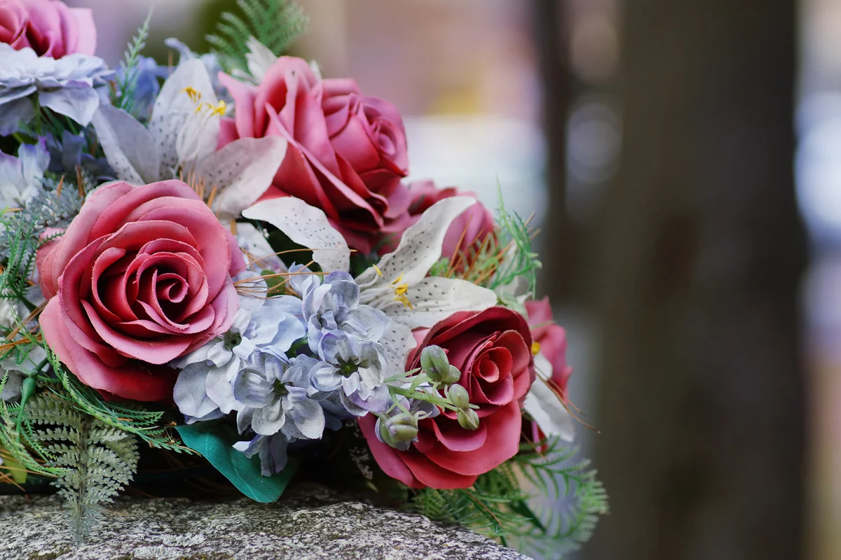 Silk flowers on a gravestone