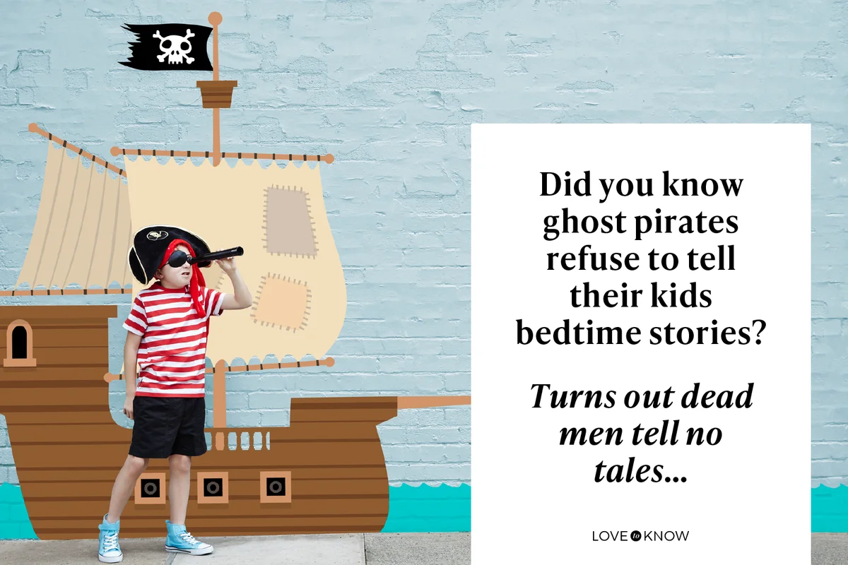 Boy dressed as a pirate with cartoon ship