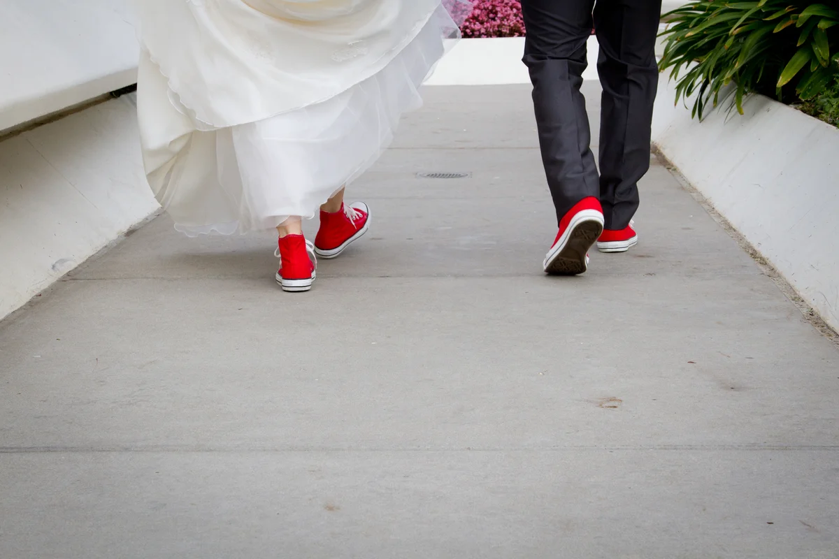 wedding couple wearing red chucks