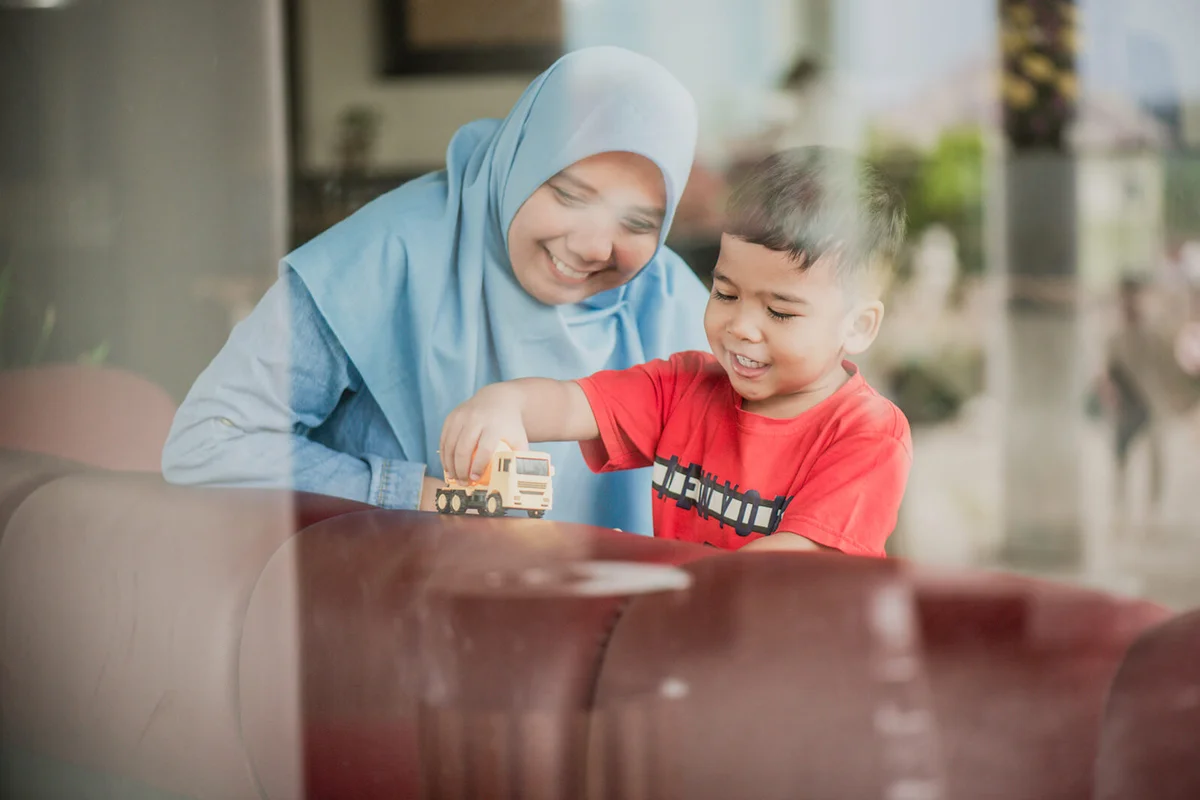 Mother and Toddler Son through glass window