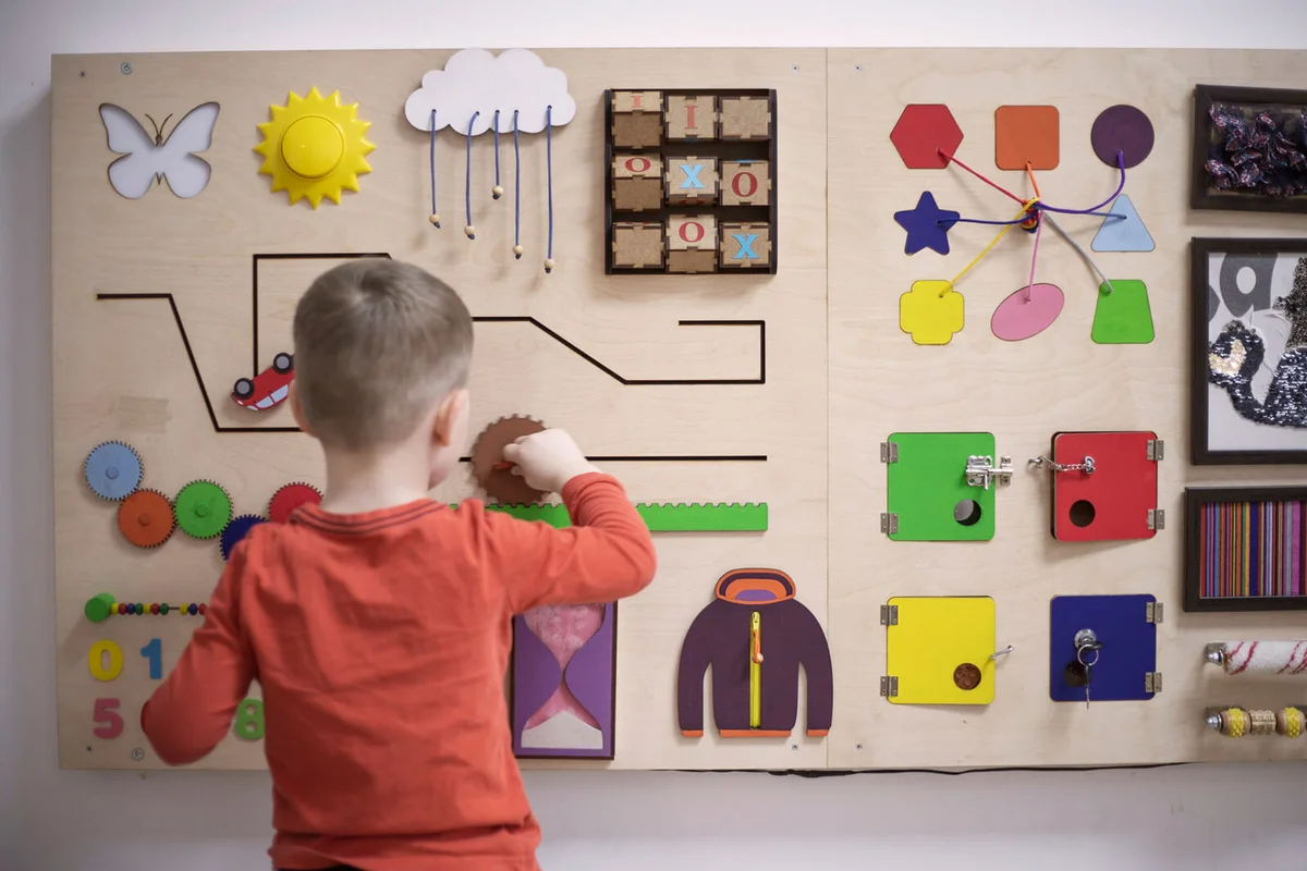 Boy playing with the interactive board