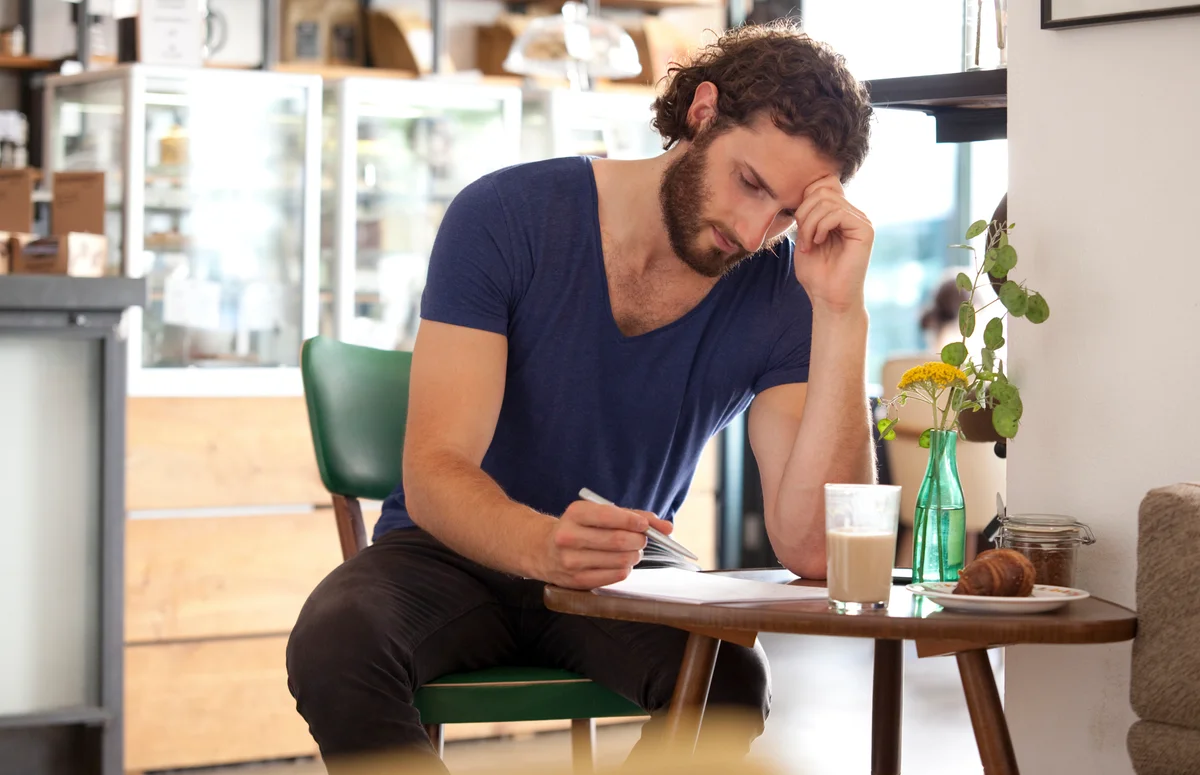 Guy writing letter
