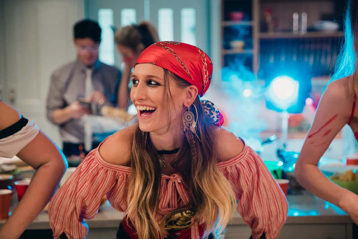 Woman dressed in pirate costume at party