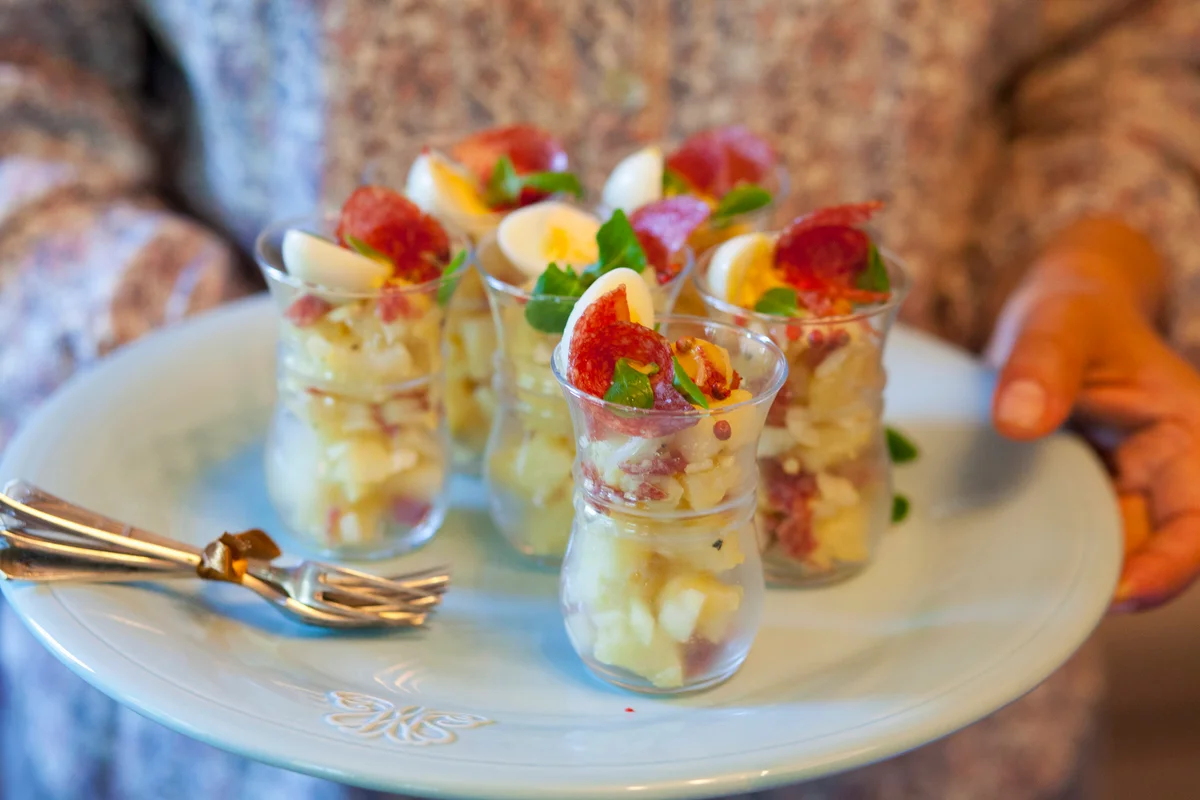 Charcuterie served in glasses on a serving tray