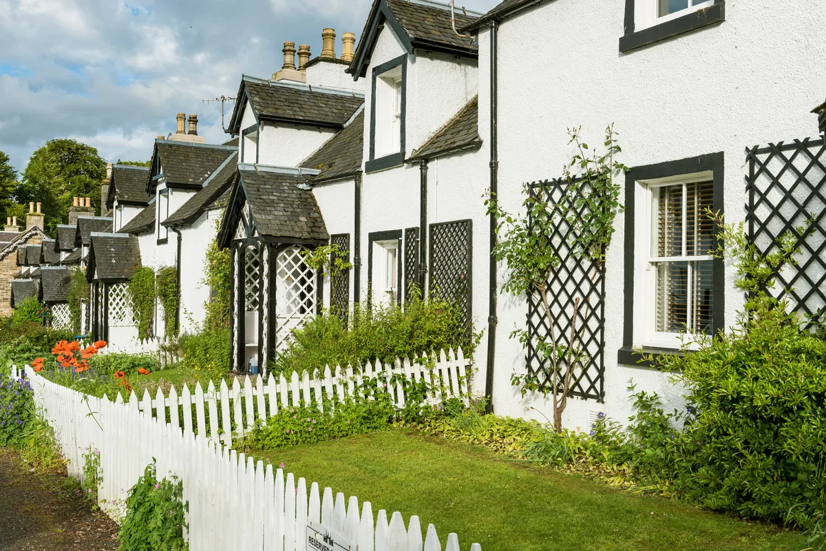 Traditional whitewashed cottages with lattice