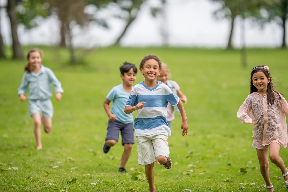 Kids playing a game of tag outside