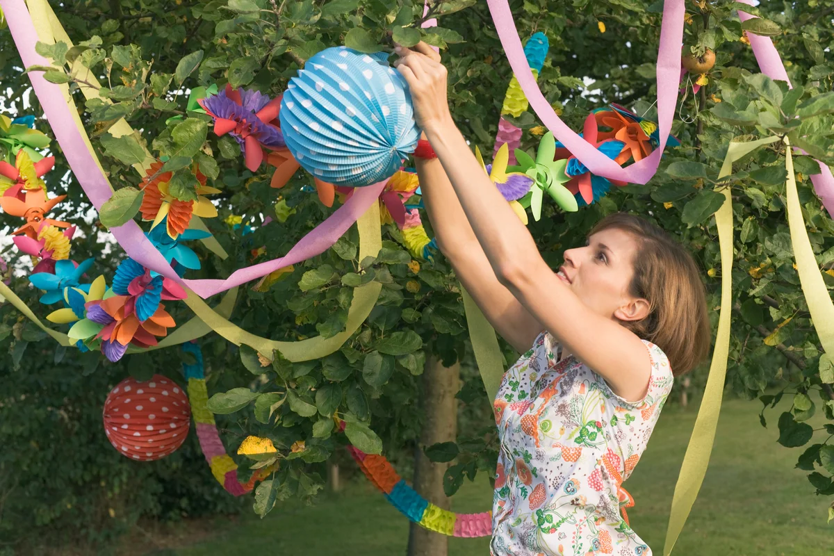 woman decorating with streamers