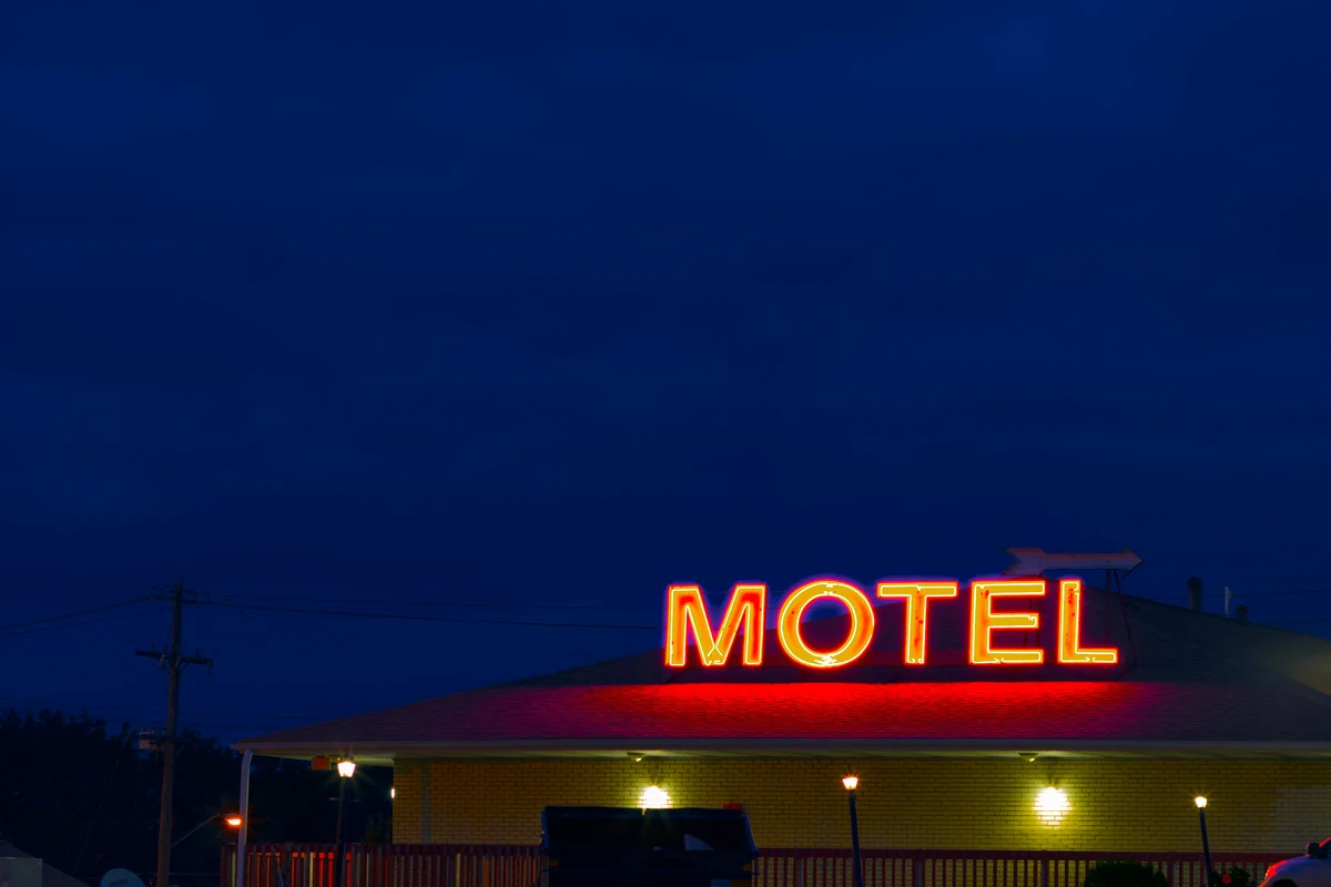 Old neon motel sign at night