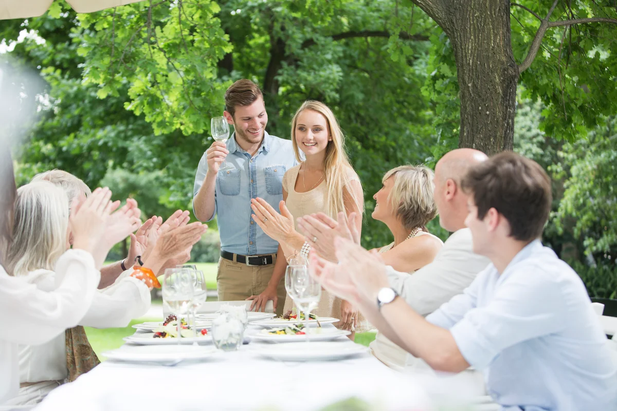 couple toasting at their engagement party