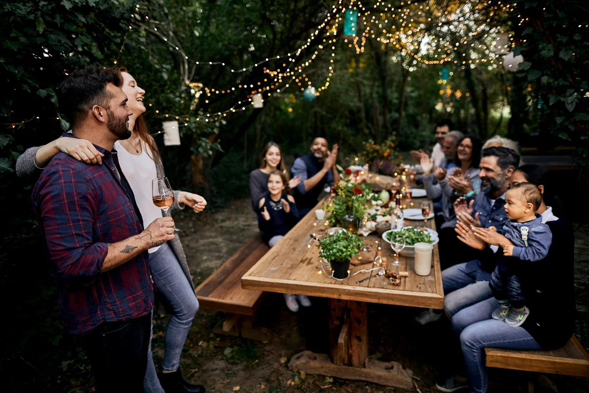 couple making speech at engagement party