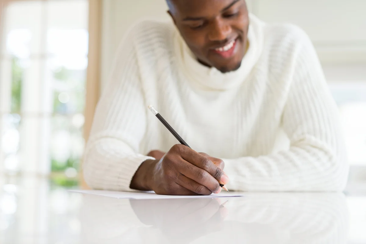 Person writing a letter